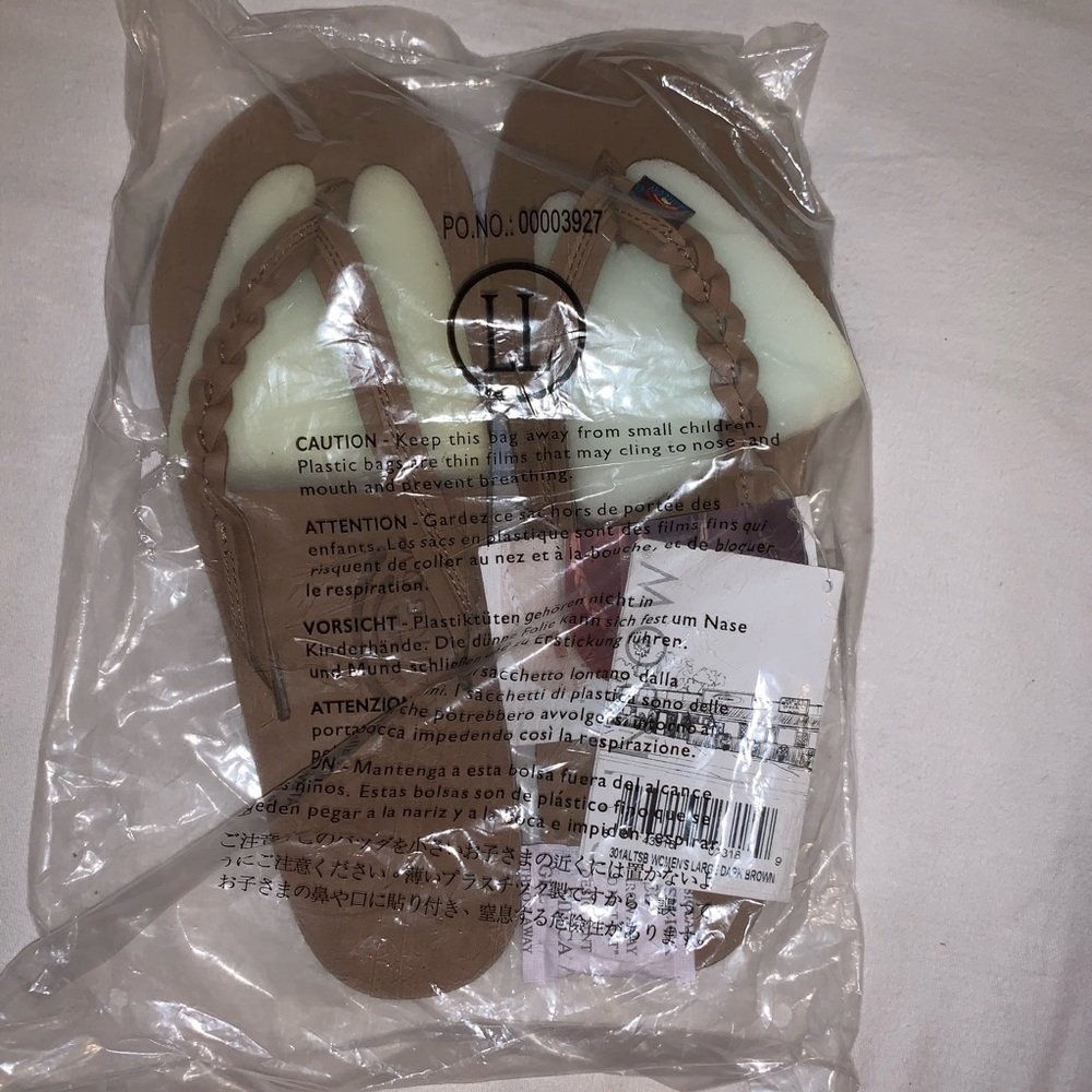 NWT women’s rainbow flip flops